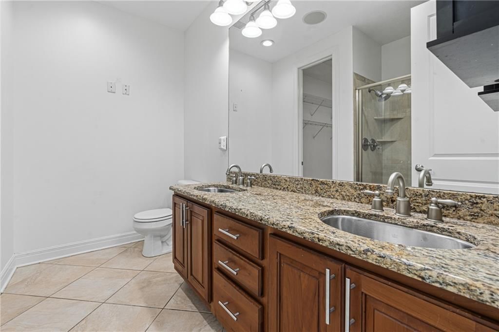 Double vanity and wood vanity at 1101 Walnut Street #907, Kansas City, MO 64106