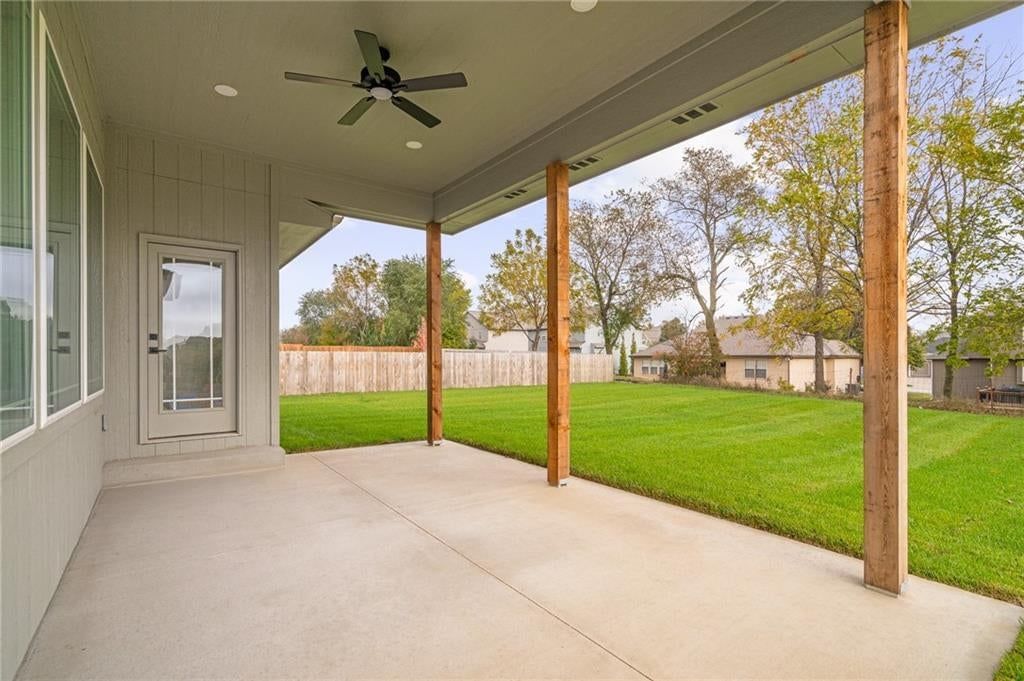 Big backyard, fenced yard and covered patio at 12940 Sewell Avenue, Kansas City, KS 66111