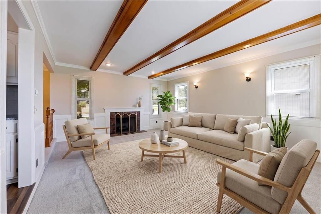 Fireplace, wainscoting or board and batten and ceiling beams at 12490 S Ortega Drive, Olathe, KS 66062