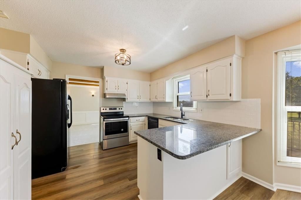 Photo 13: white kitchen cabinets, 12490 S Ortega Drive, Olathe, KS 66062