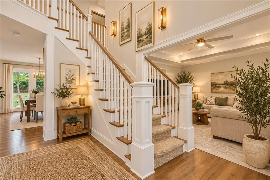 Hardwood floors, staircase and wood stair railing at 15821 Horton Court, Overland Park, KS 66223