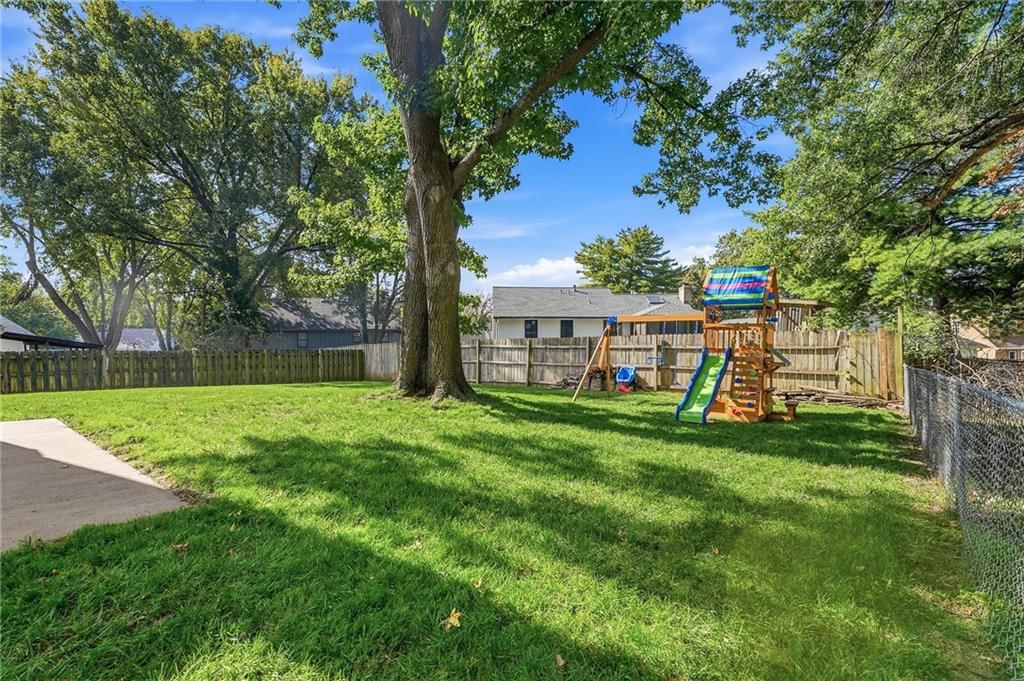 Big backyard, fenced yard and mature trees at 800 SW Savannah Drive, Lee's Summit, MO 64081