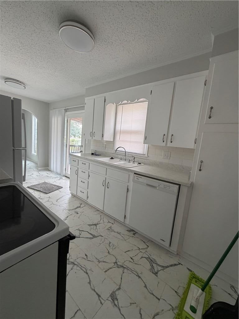 Open floor plan, white kitchen and white appliances at 1305 Farview Drive, Independence, MO 64056