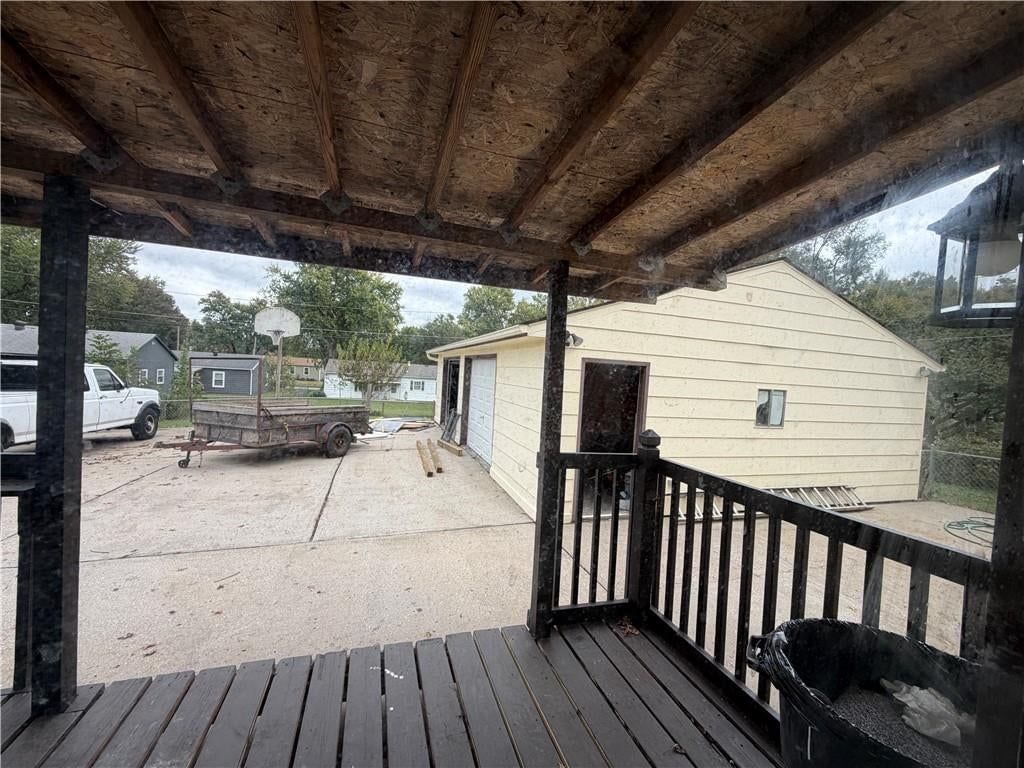 Deck, fenced yard and covered patio at 1305 Farview Drive, Independence, MO 64056