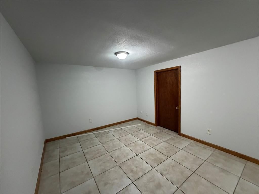 Finished basement and tile floors at 1305 Farview Drive, Independence, MO 64056