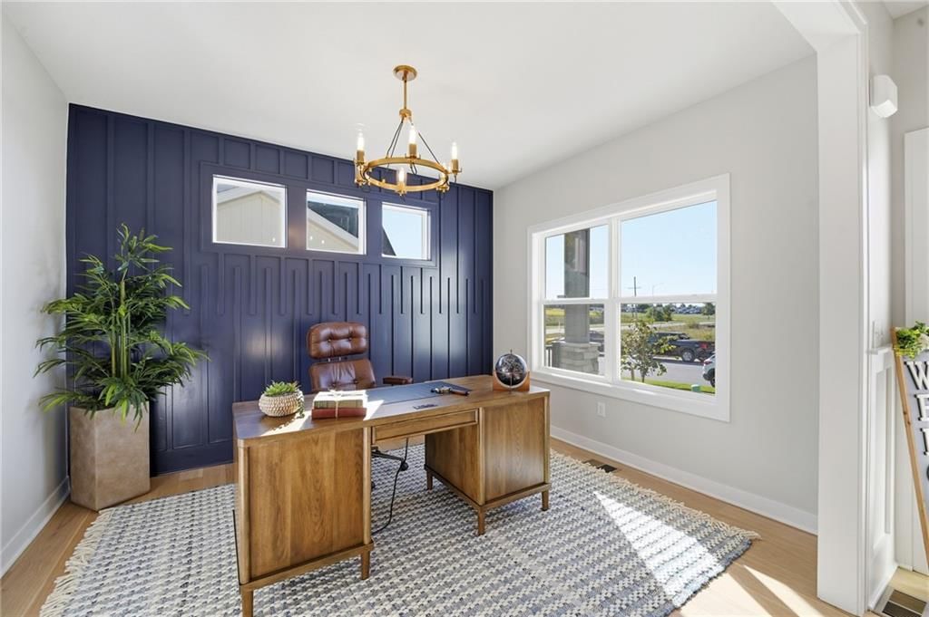 Home office, statement lighting and accent wall at 18360 W 195th Street, Spring Hill, KS 66083