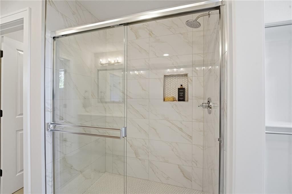 Walk-in shower and tiled shower at 18360 W 195th Street, Spring Hill, KS 66083