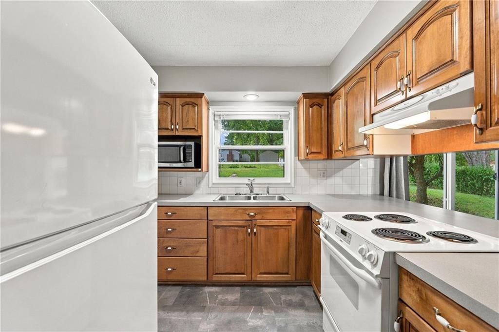 White appliances and electric range at 10601 E Sheley Road, Independence, MO 64052