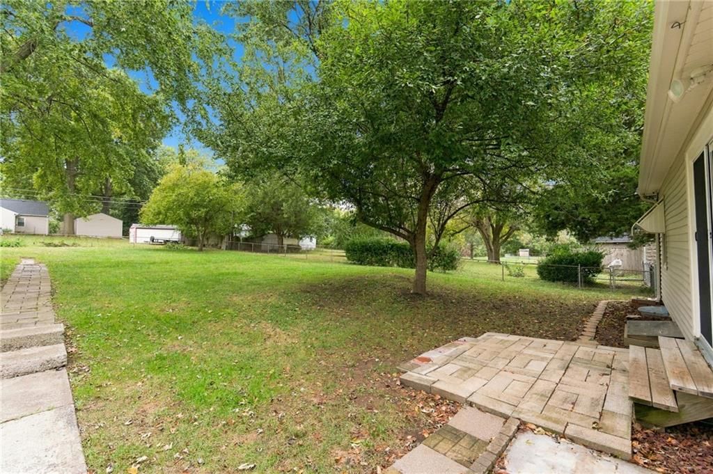 Big backyard, fenced yard and mature trees at 10601 E Sheley Road, Independence, MO 64052