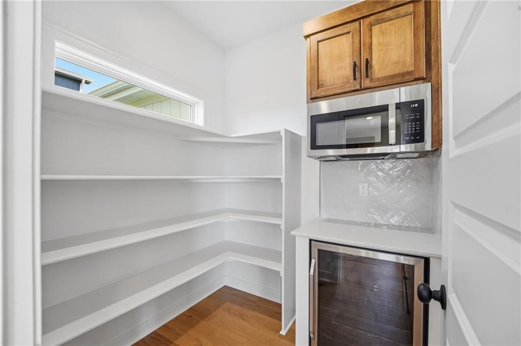 Walk-in pantry and black hardware at 18425 W 195th Street, Spring Hill, KS 66083