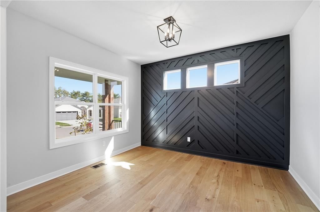 Wainscoting or board and batten, white trim and accent wall at 18425 W 195th Street, Spring Hill, KS 66083