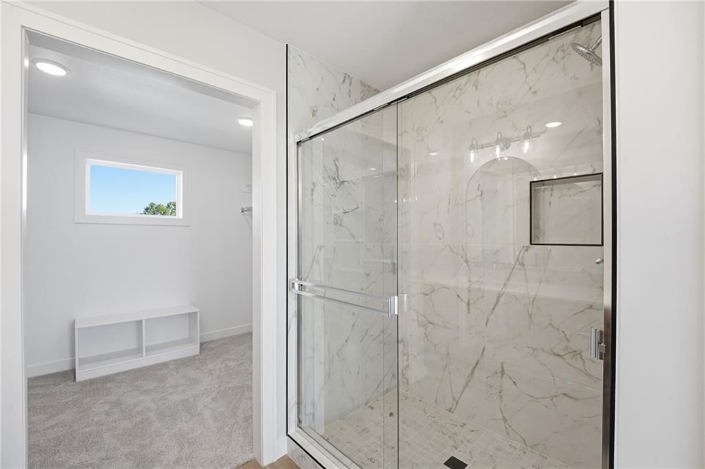 Walk-in shower and tiled shower at 18425 W 195th Street, Spring Hill, KS 66083