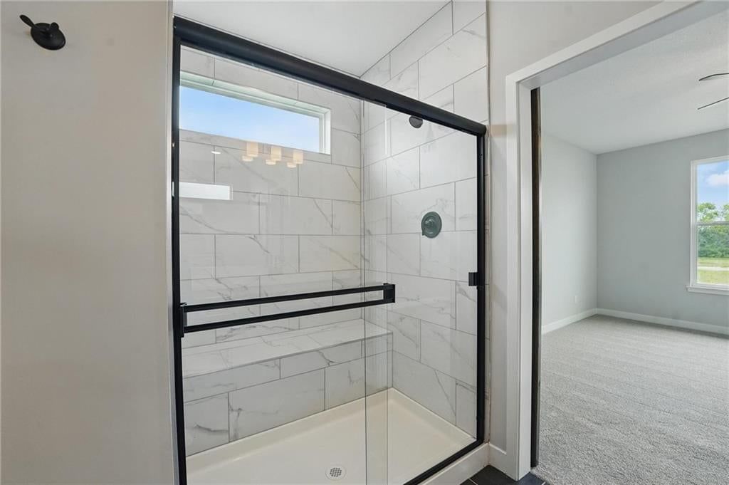 Walk-in shower and tiled shower at 27016 E Olive Drive, Lee's Summit, MO 64086