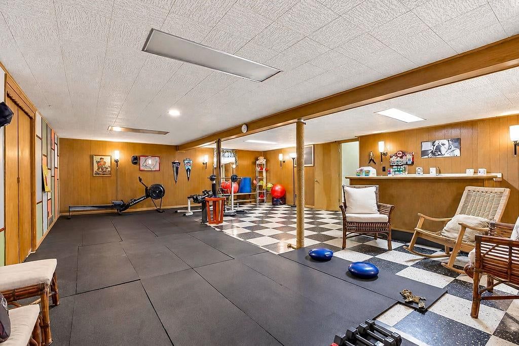 Finished basement, home gym and staircase at 3109 W 79th Terrace, Prairie Village, KS 66208