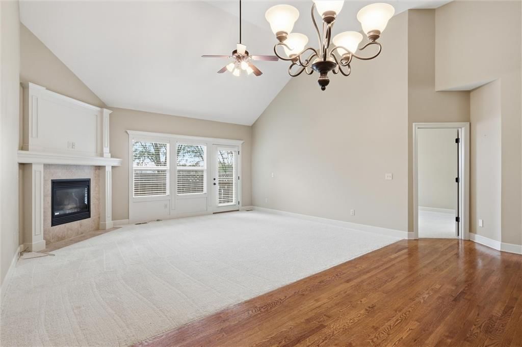 Tall ceilings, fireplace and open floor plan at 811 NE Lone Hill Drive, Lee's Summit, MO 64064