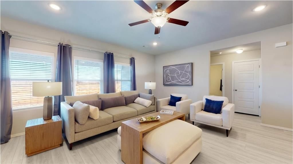 Tall ceilings and wall of windows at 701 SW 6th Terrace, Oak Grove, MO 64075