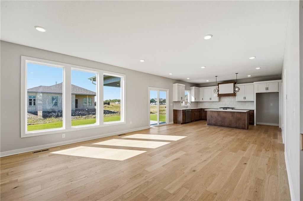 Open floor plan and wall of windows at 18455 W 195th Street, Spring Hill, KS 66083