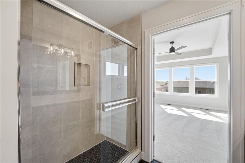 Walk-in shower and tiled shower at 18455 W 195th Street, Spring Hill, KS 66083