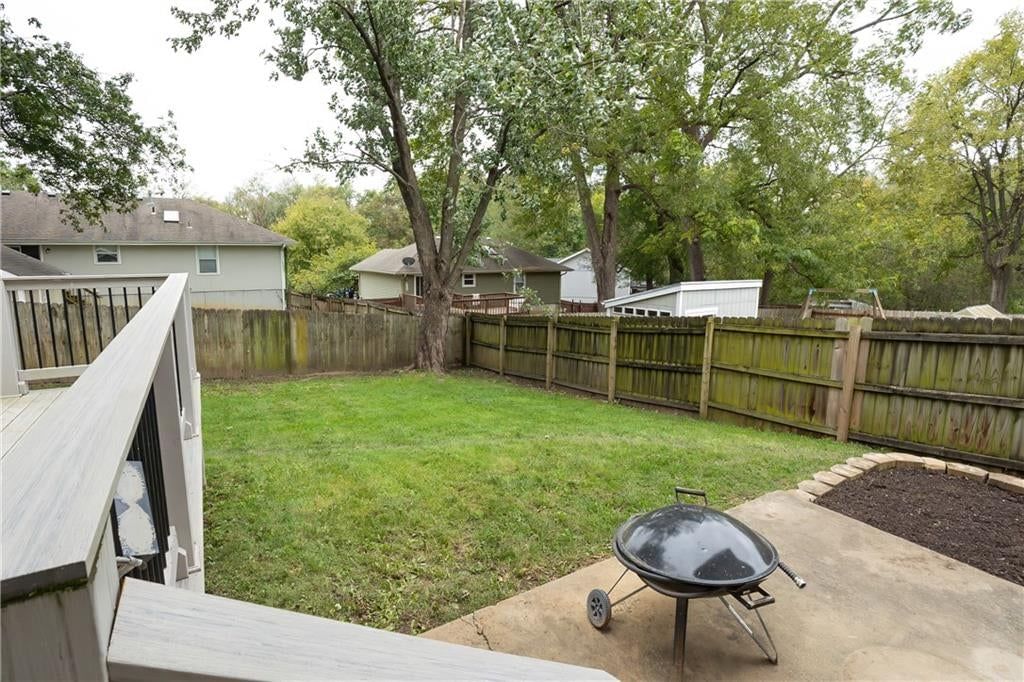 Fire pit and concrete patio at 140 Debra Street, Lansing, KS 66043