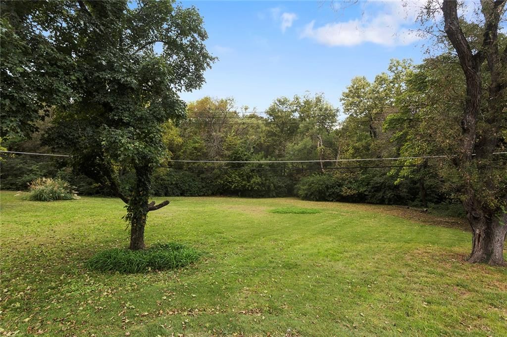 Big backyard, mature trees and flat lot at 9730 State Line Road, Leawood, KS 66206