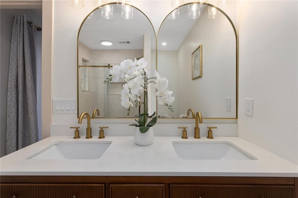 Double vanity and wood vanity at 9730 State Line Road, Leawood, KS 66206