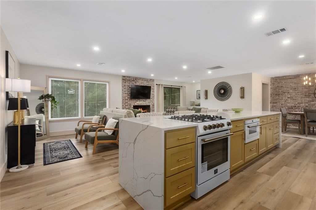 Open floor plan, exposed brick wall and white trim at 9730 State Line Road, Leawood, KS 66206