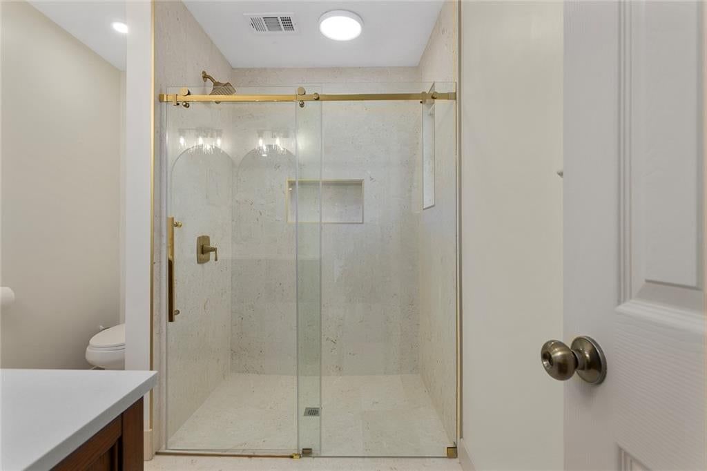 Walk-in shower, tiled shower and frameless glass shower at 9730 State Line Road, Leawood, KS 66206