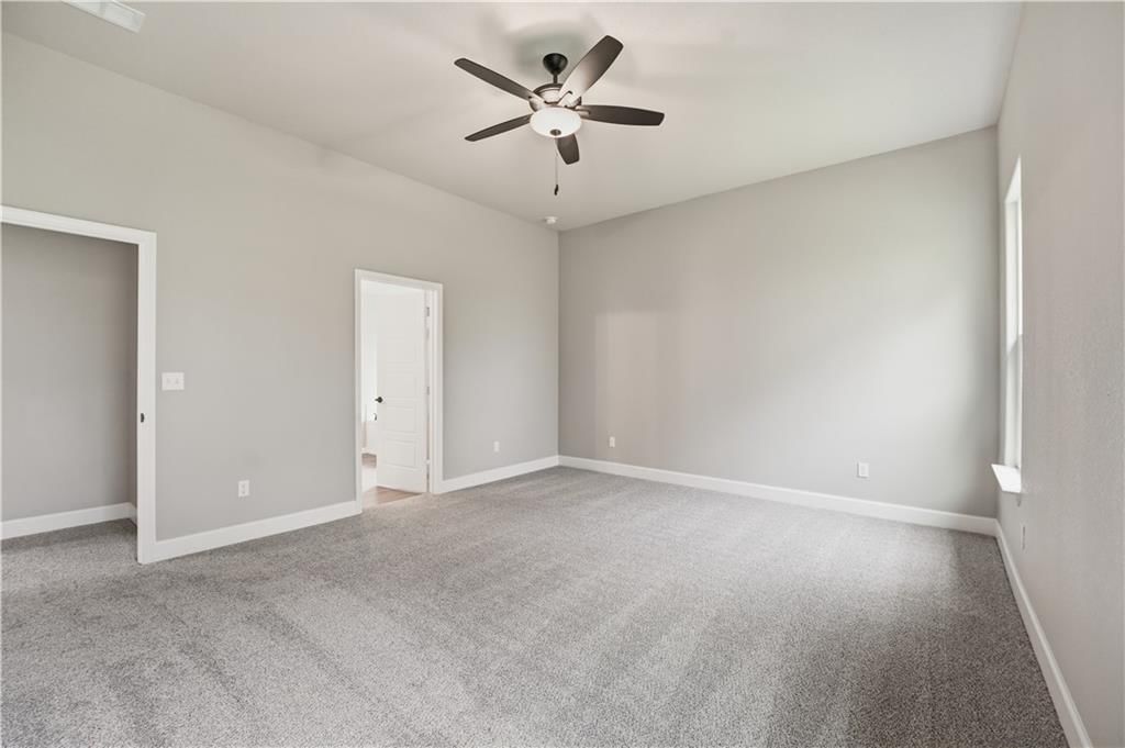 Main-floor primary bedroom at 18420 W 195th Street, Spring Hill, KS 66083