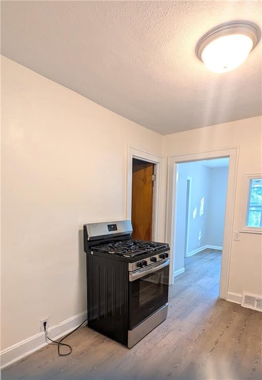Gas range and black appliances at 439 E Aberdeen Street, Independence, MO 64055