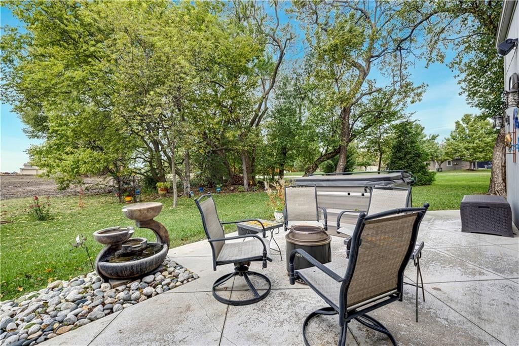 Hot tub, fire pit and concrete patio at 16300 S Britton Street, Olathe, KS 66062