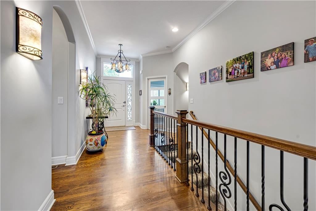 Hardwood floors, staircase and iron stair railing at 16300 S Britton Street, Olathe, KS 66062