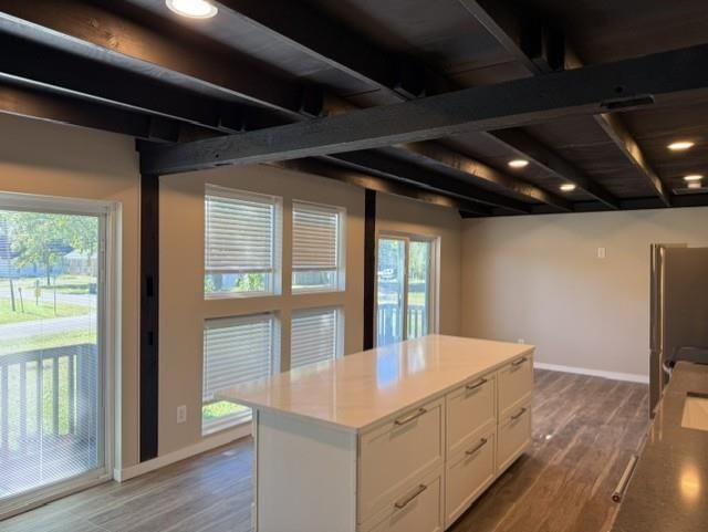 Open floor plan, kitchen island and white kitchen at 409 Holden Street, East Lynne, MO 64743