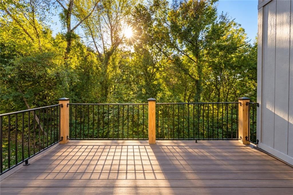 Deck, mature trees and composite deck at 10245 Magnolia Lane, Parkville, MO 64152