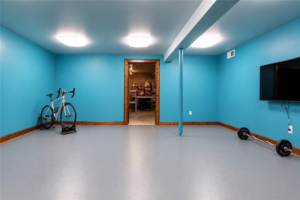 Finished basement and home gym at 10245 Magnolia Lane, Parkville, MO 64152