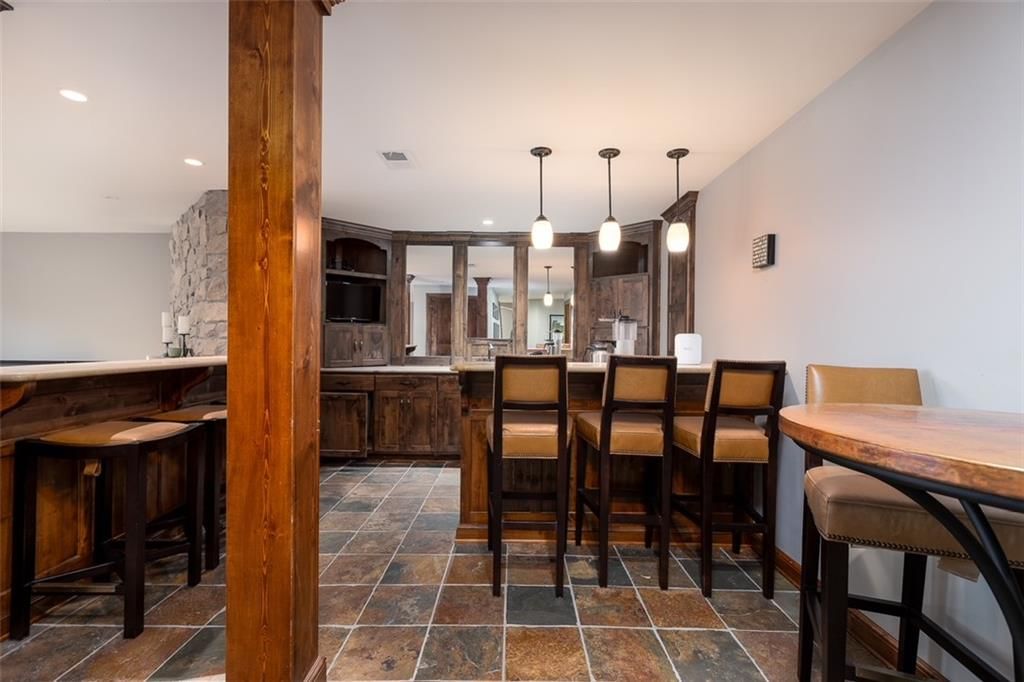 Granite counters, kitchen backsplash and tile backsplash type at 10245 Magnolia Lane, Parkville, MO 64152