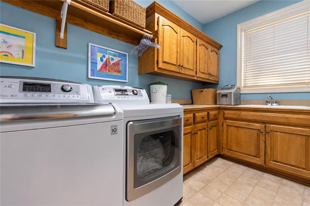 Laundry cabinets at 10245 Magnolia Lane, Parkville, MO 64152