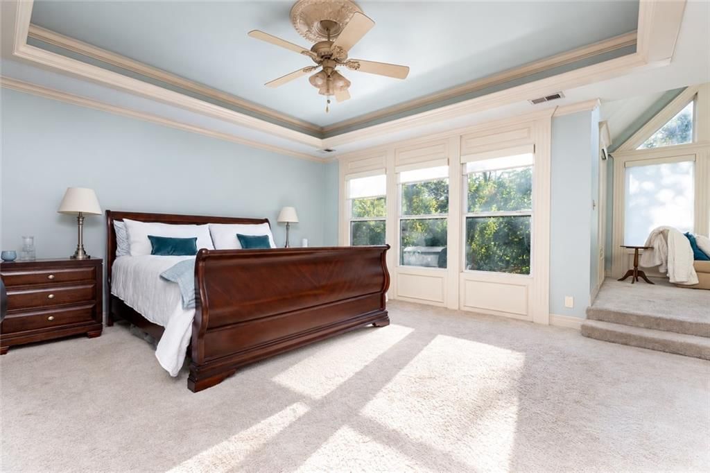 Main-floor primary bedroom at 10245 Magnolia Lane, Parkville, MO 64152