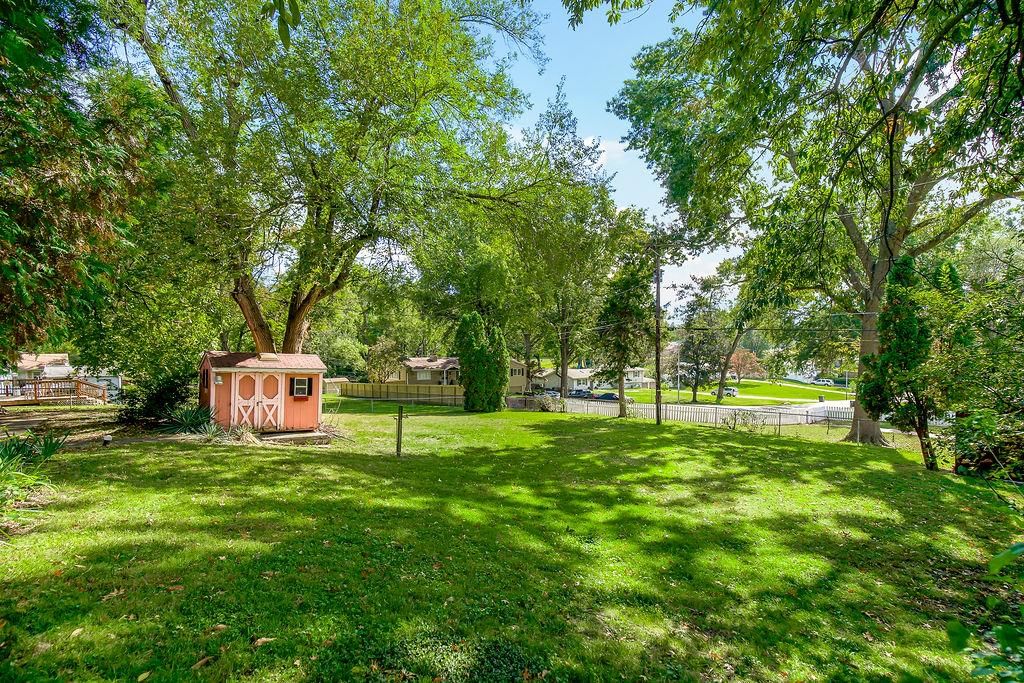 Big backyard, fenced yard and mature trees at 11801 E 45TH Terrace, Kansas City, MO 64133