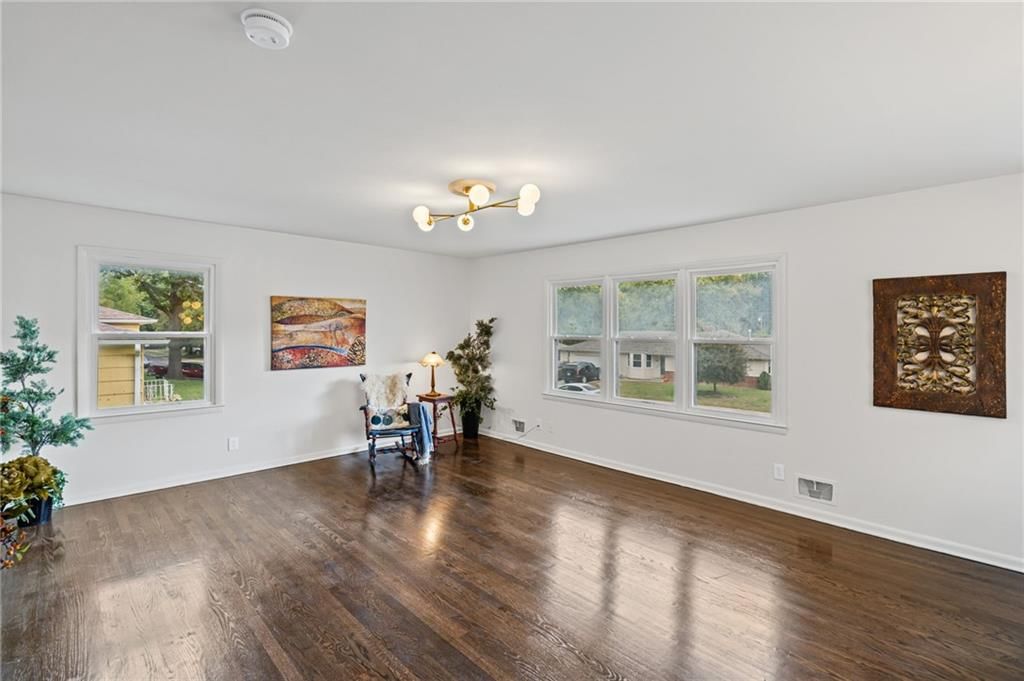 Hardwood floors and statement lighting at 7312 Hedges Avenue, Raytown, MO 64133