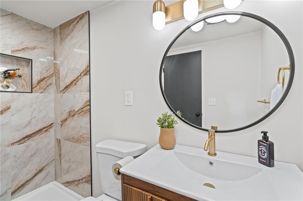 Walk-in shower and tiled shower at 7312 Hedges Avenue, Raytown, MO 64133