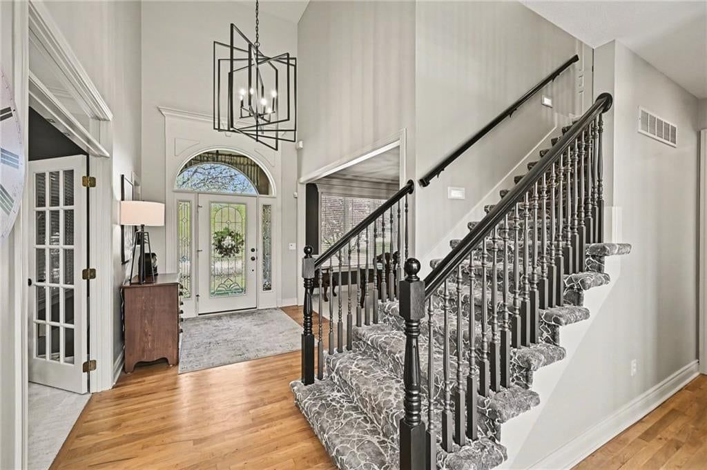 Wood stair railing at 10139 N Montgall Avenue, Kansas City, MO 64155