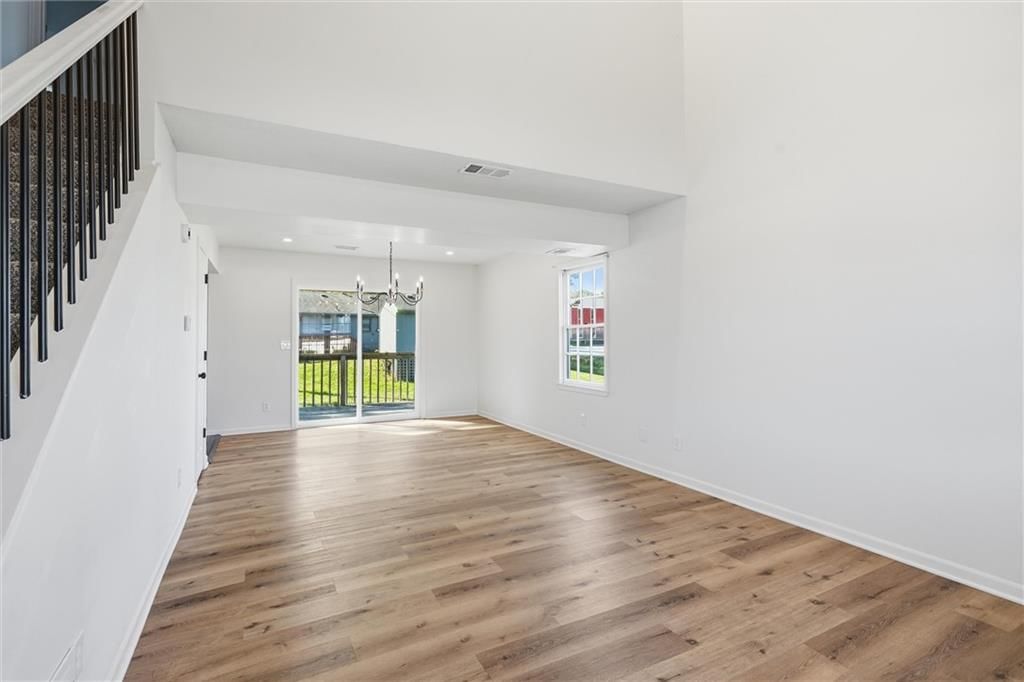 Open floor plan, hardwood floors and recessed lighting at 307B E Main Street, Smithville, MO 64089