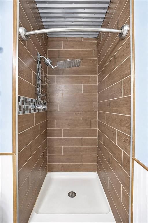Walk-in shower and tiled shower at 11712 E 62nd Terrace, Kansas City, MO 64133