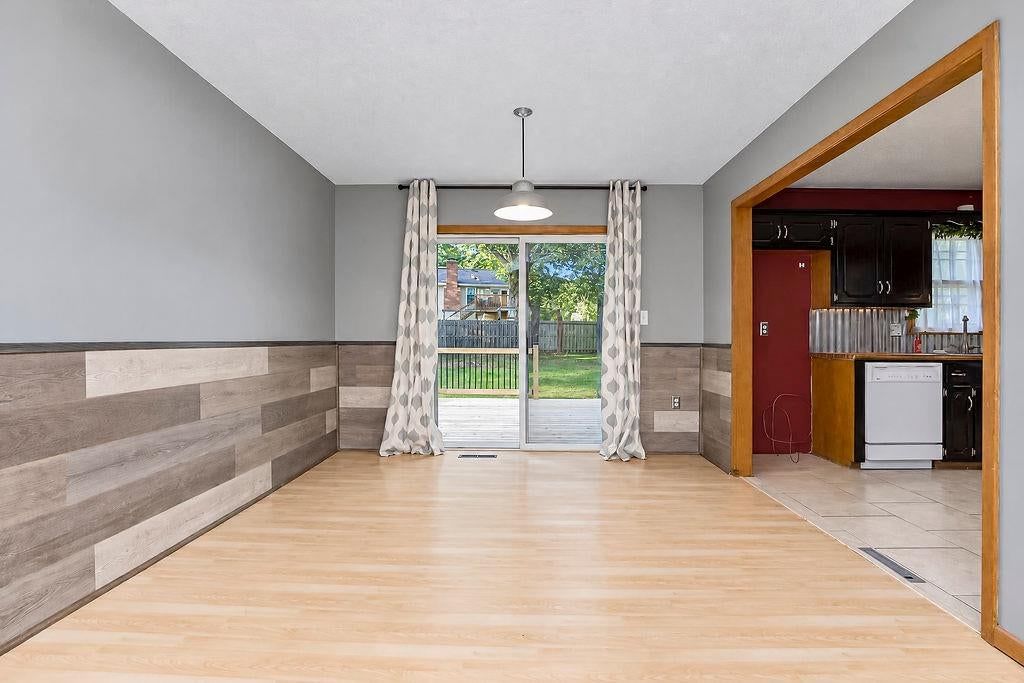 Open floor plan and shiplap / paneling at 11712 E 62nd Terrace, Kansas City, MO 64133
