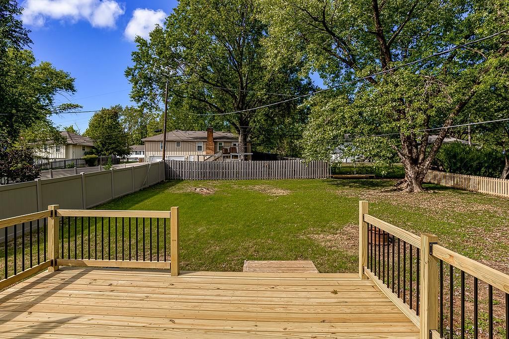 Deck, fenced yard and vinyl fence at 11712 E 62nd Terrace, Kansas City, MO 64133