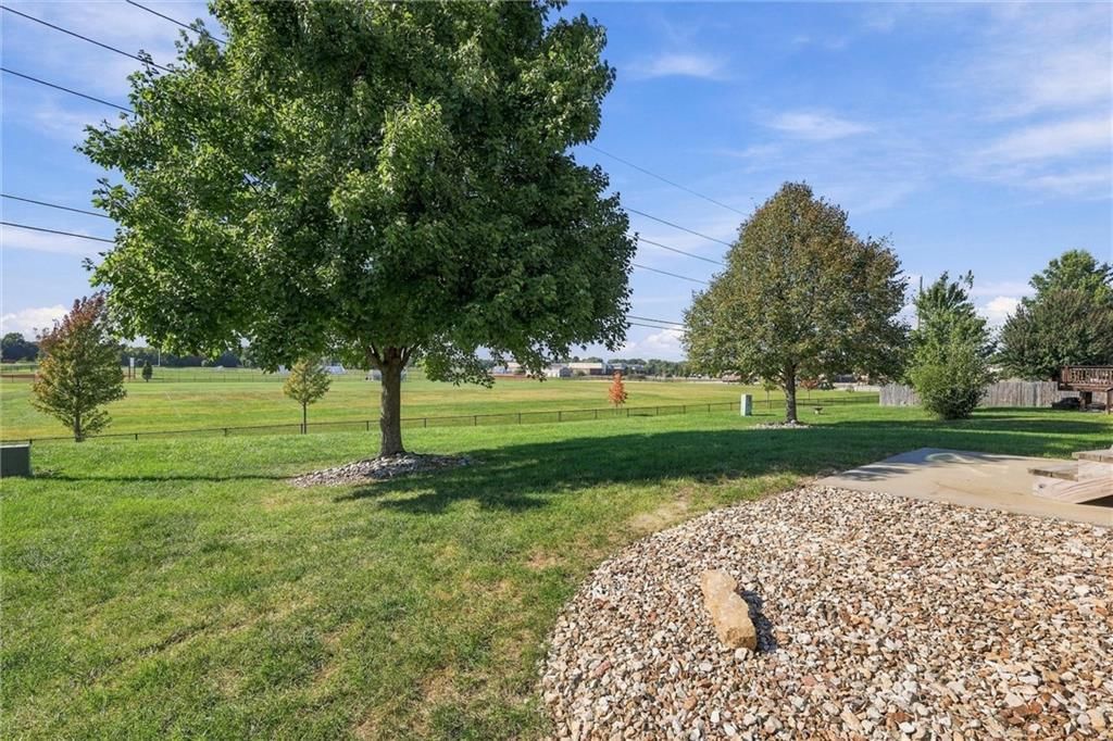 Big backyard, mature trees and flat lot at 600 S Maple Street, Gardner, KS 66030