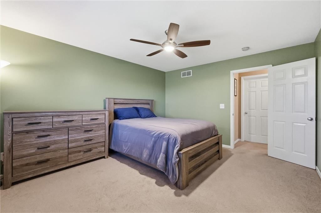 Main-floor primary bedroom at 600 S Maple Street, Gardner, KS 66030