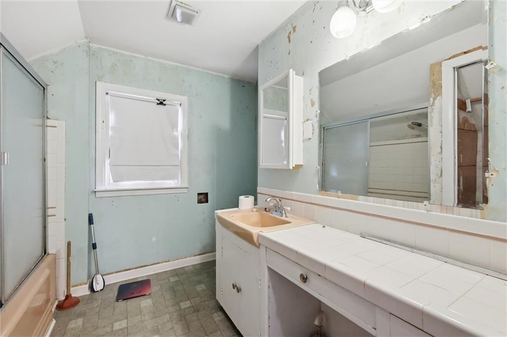 Tile floors, tiled shower and double vanity at 24 Fairview Avenue, Liberty, MO 64068