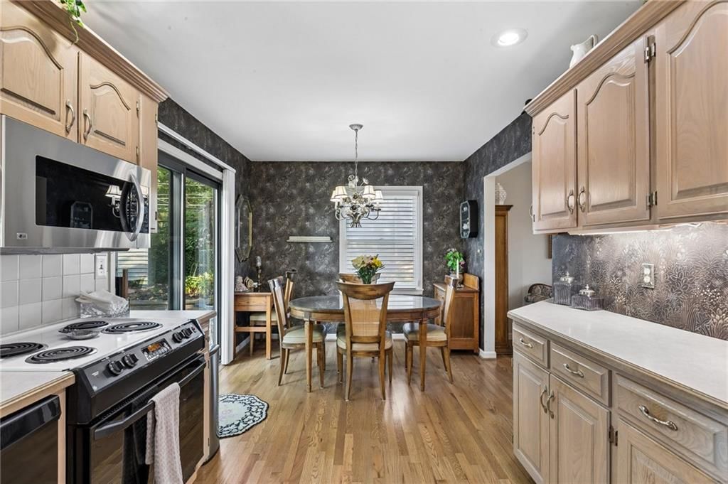 Chandelier and breakfast nook at 1513 NE Englewood Road, Kansas City, MO 64118