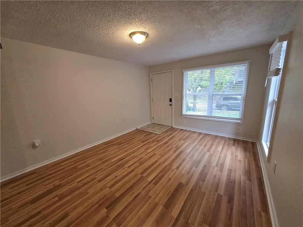 Hardwood floors and beige walls at 100 S Willis Avenue, Independence, MO 64050